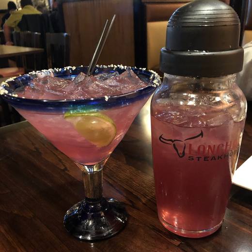 Desert pear margarita with shaker at Longhorn Steakhouse, Cedar Park